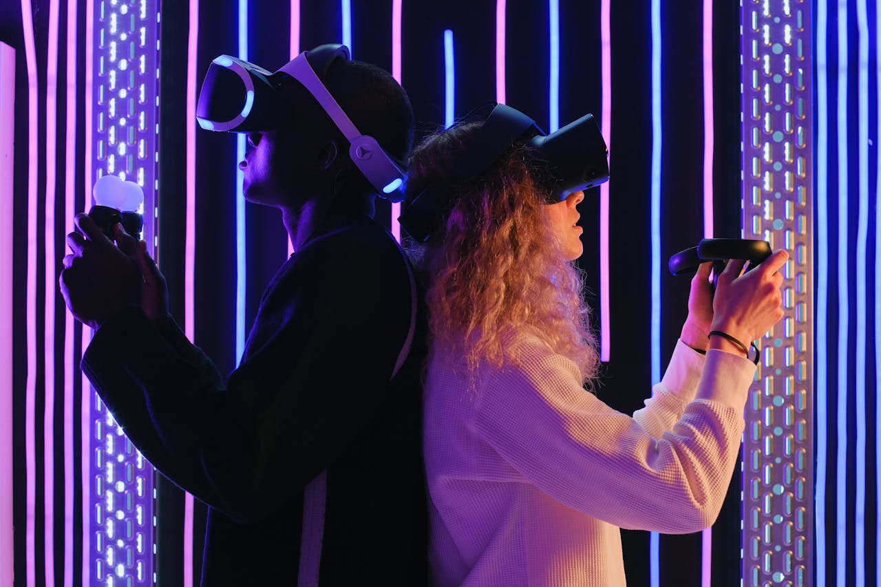 discover Two adults engaged in virtual reality gaming with VR headsets in a vibrant, neon-lit environment.
